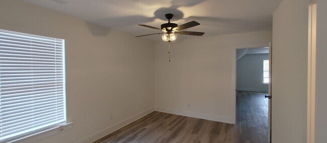 Building Photo - 5-bedroom home with 3 car garage and fully...
