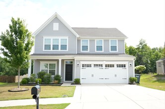 Building Photo - This wonderful home has a covered rocking ...