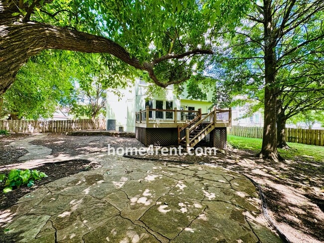 Building Photo - Blue Valley Schools w/ Wood Floors, Finished Basement and a Peaceful, Private Fenced Yard!