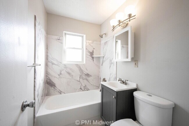 Building Photo - "Charming 2-Bedroom Retreat with Hardwood Elegance in Indianapolis"