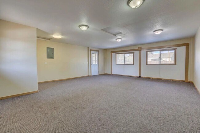 Building Photo - 1/2 acre in the with RV Hook ups