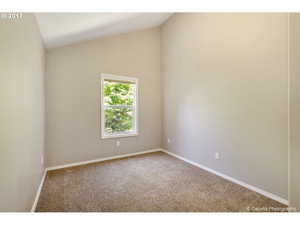 Third bedroom with tall vaulted ceilings - 7414 NE Shaleen St