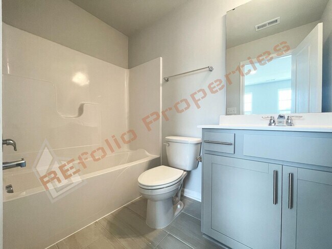 Building Photo - Brand-New 3BR/3.5BA Townhome w/ 1 Car Gara...