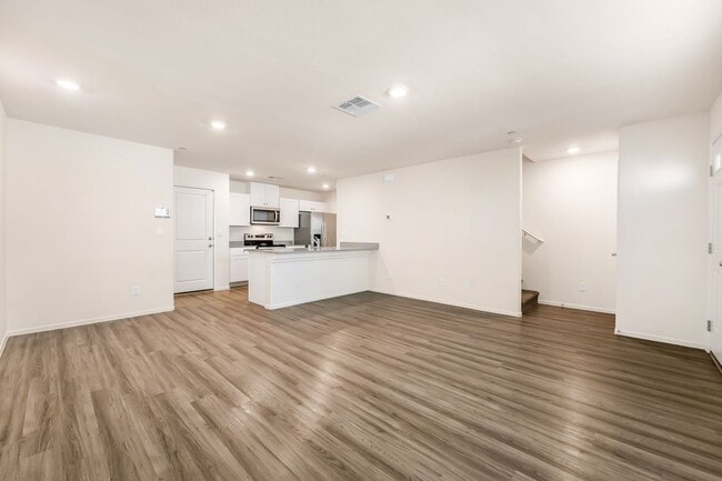 Building Photo - Modern West Henderson Townhome with Sleek Upgrades & Smart Home Features!
