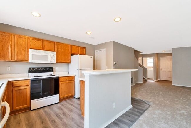Building Photo - 3BR Townhome Near DIA & Light Rail | New Carpet, Garage & Fenced Patio
