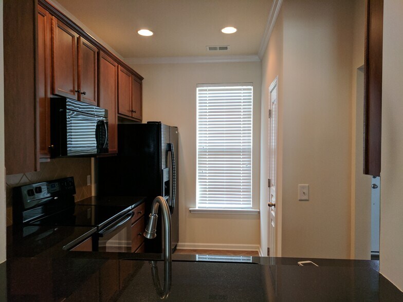 Kitchen with recessed lighting. - 205 Spring Gardens Drive
