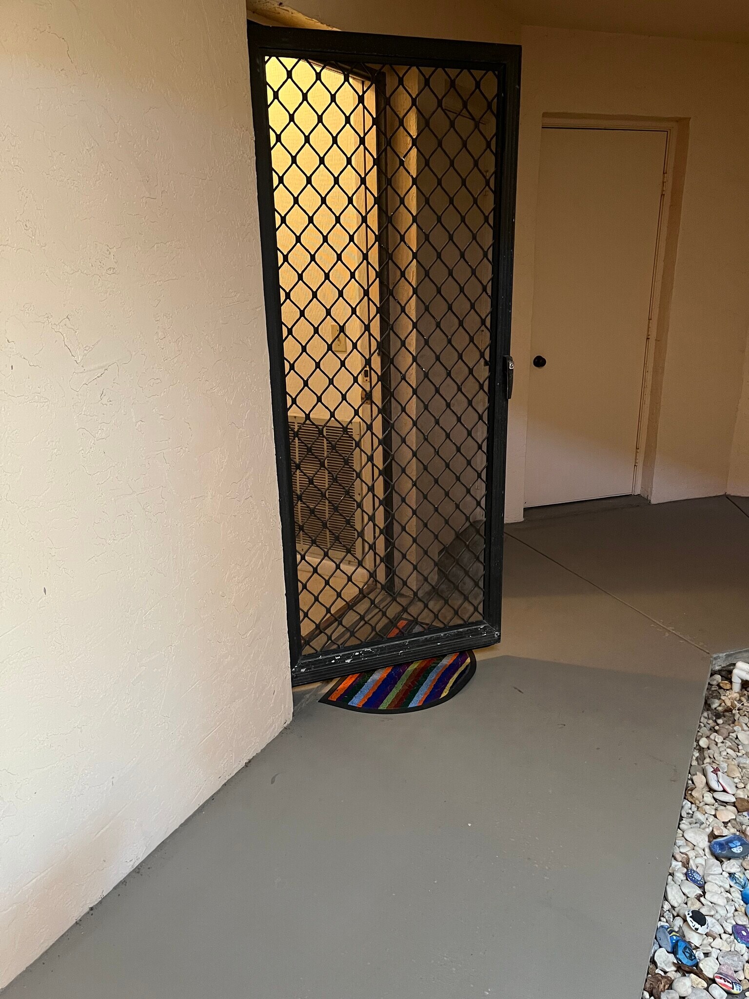 Screen door opens to an open air covered area - 1985 NE Collins Cir