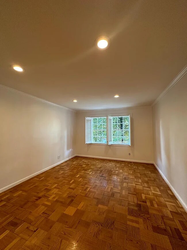 original parquet flooring and recessed lighting adorn this spacious living room! - 108 Colville Rd