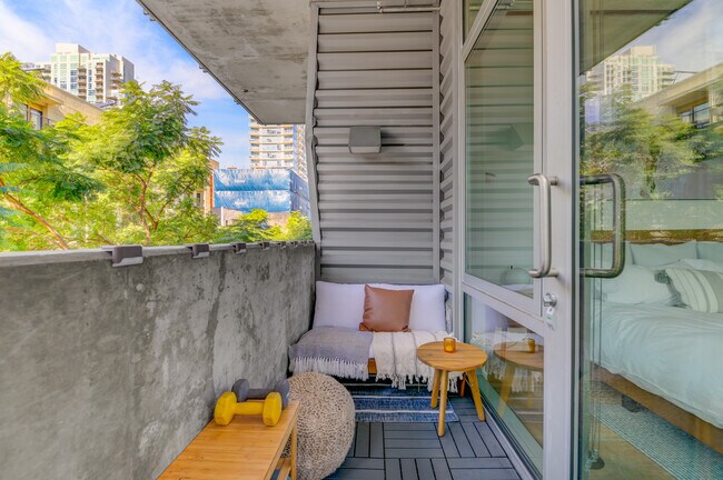 Patio with fitness essentials (dumbbells, yoga mat, resistance bands) - 1025 Island Ave