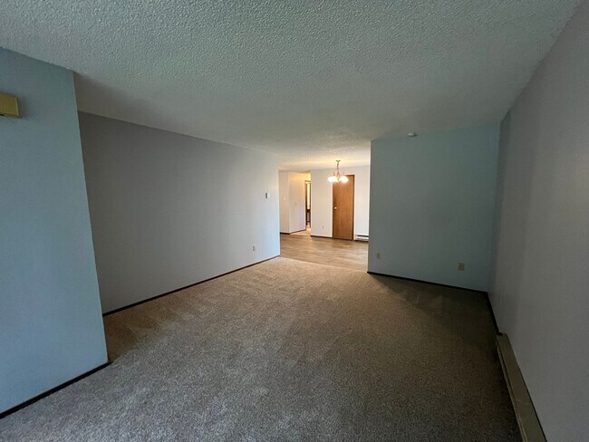 Building Photo - PENDING APPLICATIONS; New Paint & Flooring! (Water & Garbage Included)