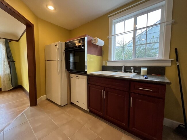 Building Photo - Classic Brick Portland Home on Stark Street with Dual Living Areas and Two Full Kitchens