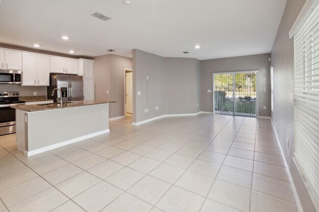 Building Photo - Like New 4/3 Townhome in Gated Community W/ Community Pool