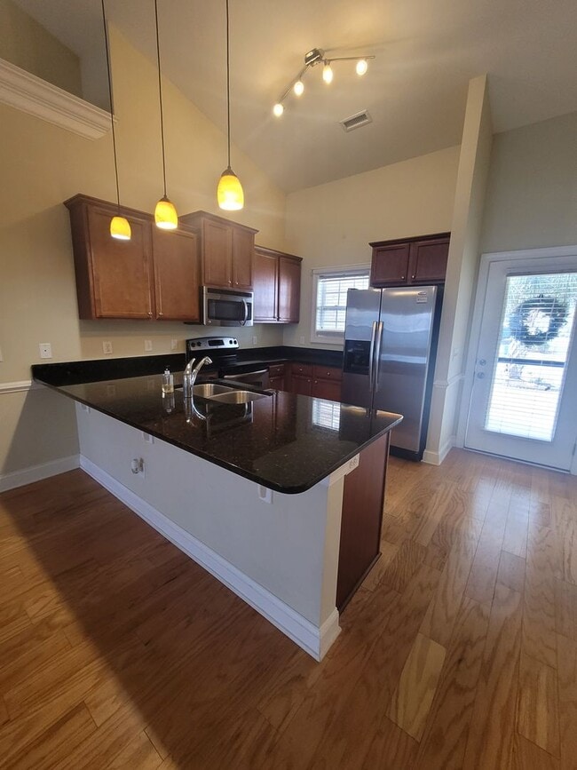 Building Photo - This 3 bedroom 2.5 bath brick townhouse with one car garage is located in Westgate Shoreline subd...