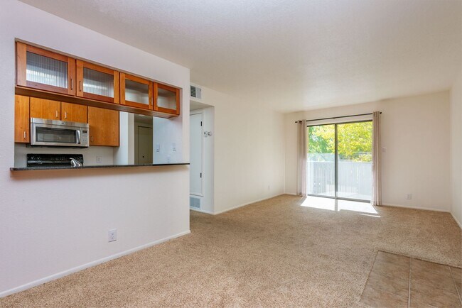 Building Photo - Light and Bright Second Level Condo Availa...