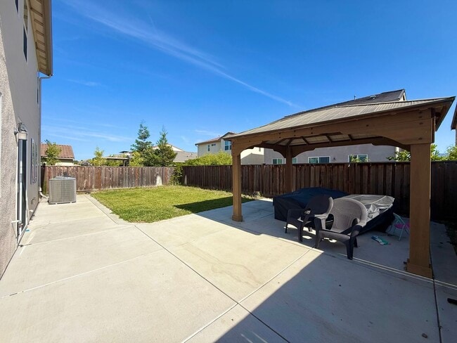 Building Photo - Spacious 5-Bedroom Home | Private Yard + Attached Garage
