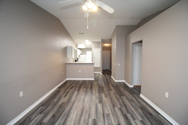 Building Photo - 2BR Patio Home with LVP Flooring, Private Fenced Yard, & Convenient Blue Angel Pkwy Location Near...