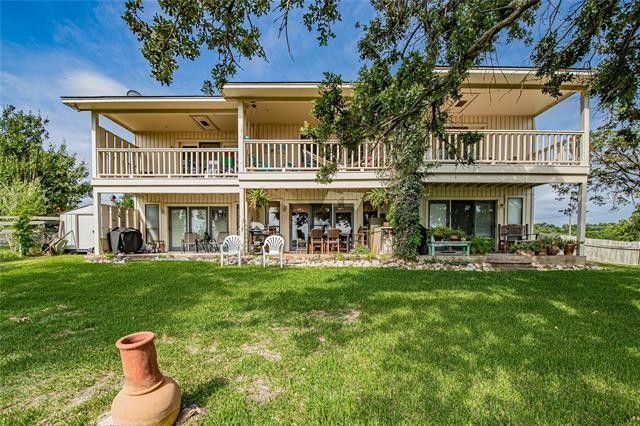 Backside with decks facing the lake - 6333 Kelly Dr