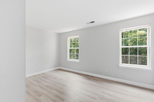 Building Photo - Experience contemporary living in this beautifully renovated residence where modern design meets ...