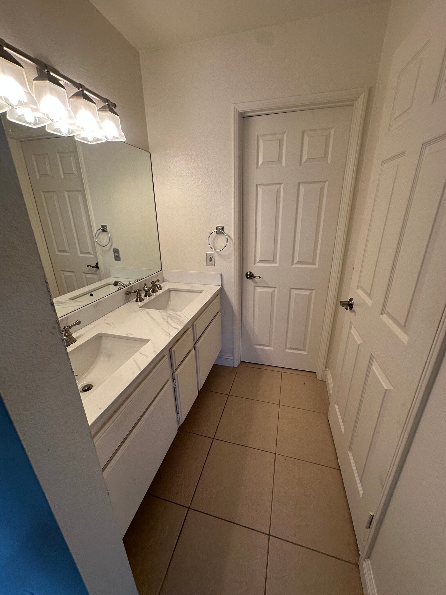 Primary bathroom with double vanity and separate room with modern shower and toilet - 22865 Del Valle St