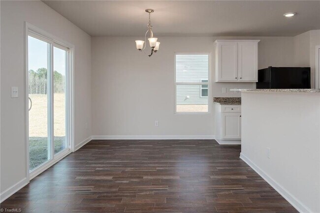 Building Photo - Spacious 3-Bedroom + Loft Home in Meredith Woods – Stylish, Efficient, and Perfect for Entertaining!