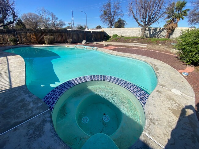 Building Photo - Get ready for Summer in this 3 BD 2 BA SW home with a Pool on a corner lot