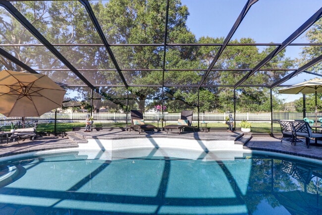 Building Photo - Fully Furnished 4-Bedroom Pool Home with Golf Course Views in Northdale