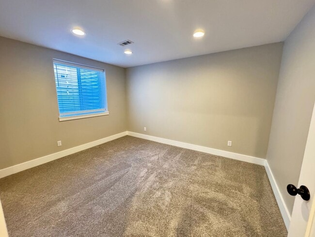 Building Photo - 4 BEDROOM, 3 BATHROOM TWINHOME WITH 2 CAR ATTACHED GARAGE IN NORTH CHEYENNE