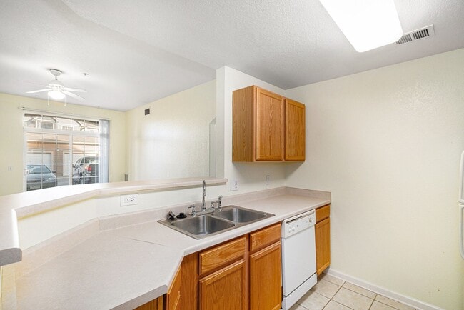 Building Photo - Bright 2-Bedroom Condo with Private Patio & Resort-Style Amenities!