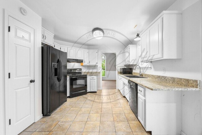 Building Photo - Four Bedroom Two Story with Two Car Garage...