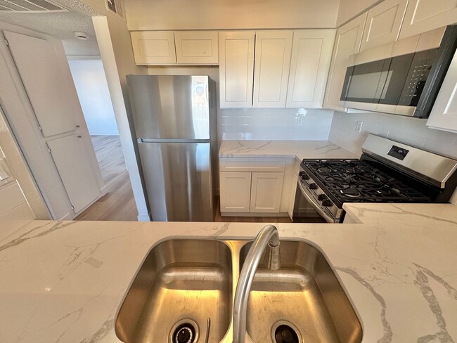 Building Photo - BRIGHT 2-BEDROOM CONDO NEAR STRIP & UNLV W/ PRIVATE BALCONY