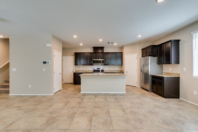 Building Photo - Spacious Townhouse with Loft & Rare 3-Car Garage!