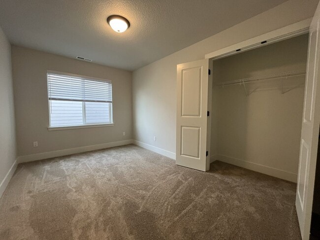 Building Photo - Modern 2025-Built 4 Bedroom Home with EV Charging, 5kW Solar, Open-Concept Living, Scenic Outdoor...