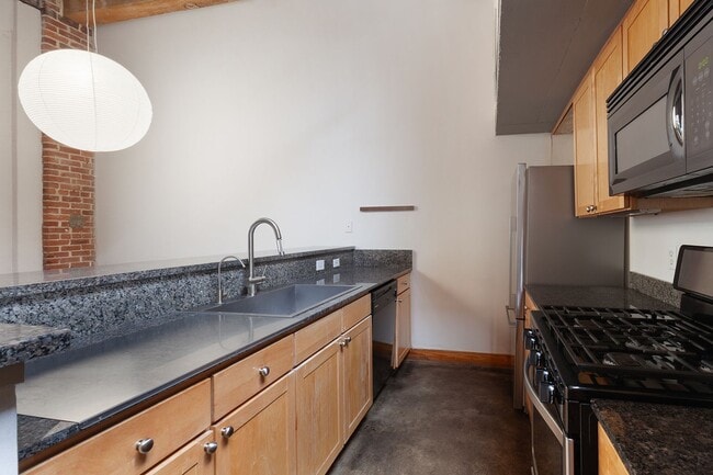 Building Photo - Industrial-Chic 2/2 Loft with Garage Near ...