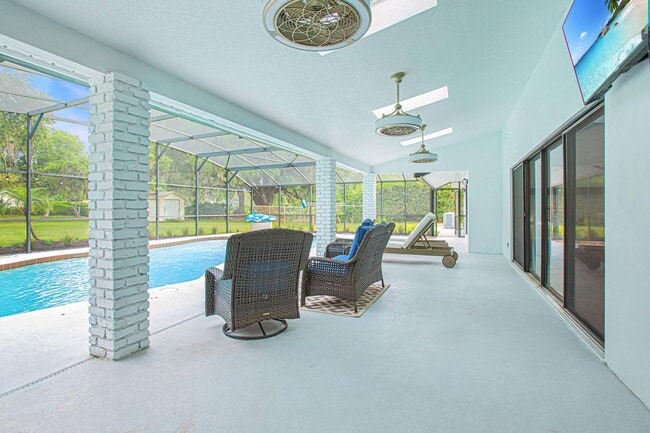 Building Photo - Beautifully Updated 3/2 Pool Home with Large Backyard in Lake Ajay (Gated Community)