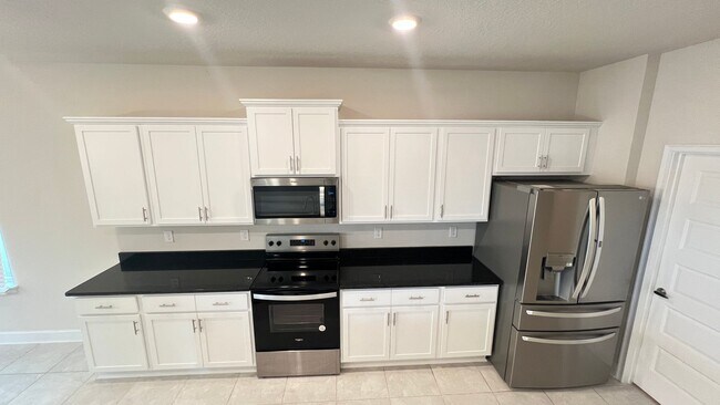 Building Photo - Beautiful Harmony Central Water Front Home AVAILABLE NOW!