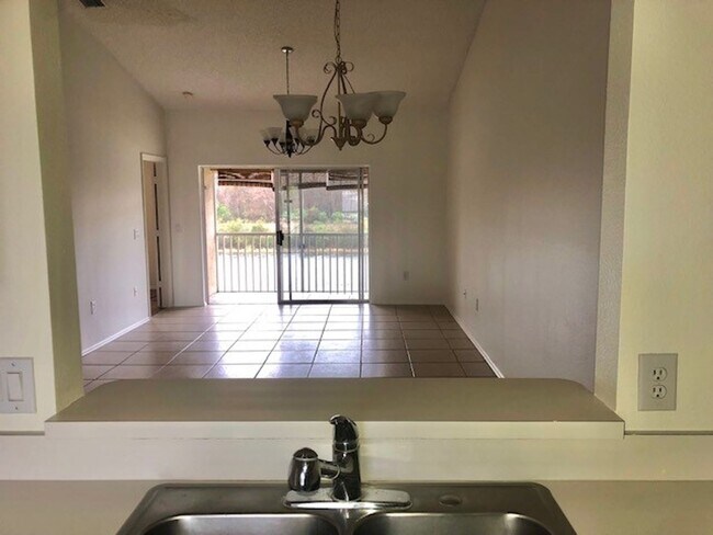 Building Photo - Nice 2X2 located on 2nd floor- Tile & lami...