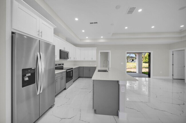 Building Photo - Brand-New Home in Lehigh Acres – Move-In Ready! FL 33974. Qualify for a deposit-free option and s...