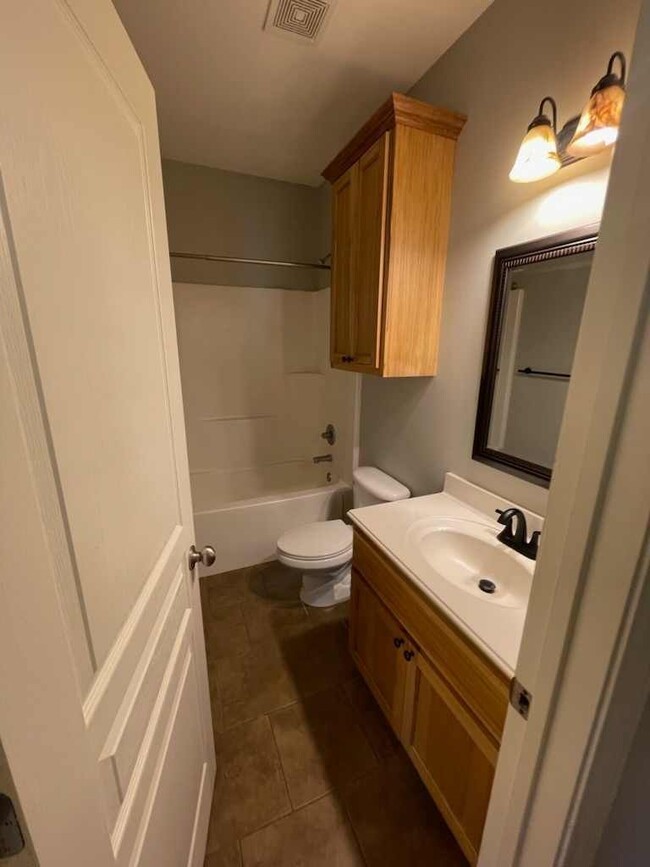 Building Photo - This spacious 3-bedroom, 2-bathroom home j...