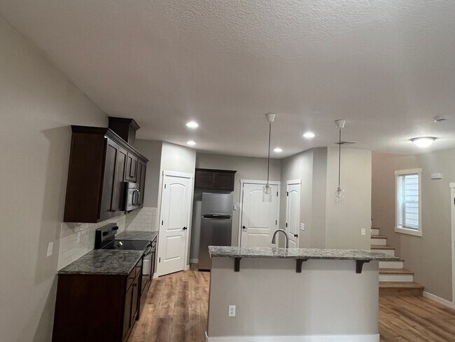 Building Photo - Recently Renovated! Spacious 3 Bedroom Home with Fenced Yard, Patio, and 2-Car Garage With Move I...