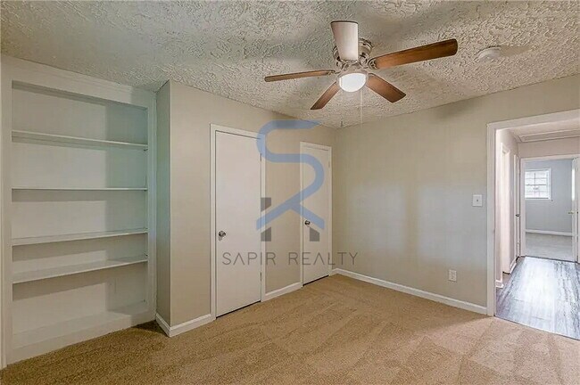 Building Photo - Move in before December 31st and choose your reward: a $250 Amazon Gift Card or a 55" Smart TV!