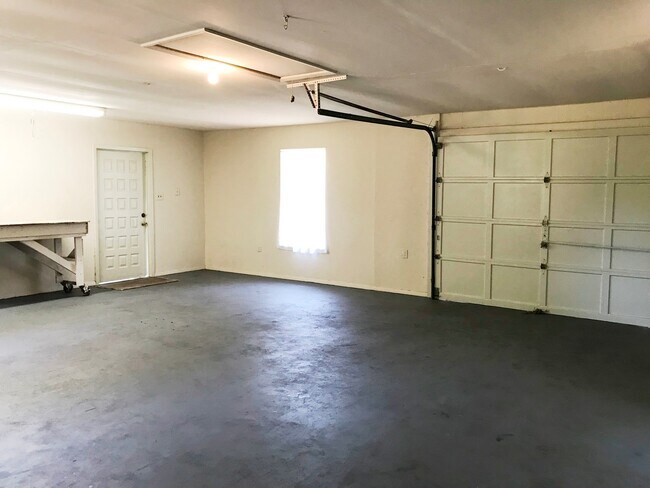 Building Photo - Unique Find! HUGE detached garage/workshop, 3 bedroom, 1 1/2 bath home, screened porch