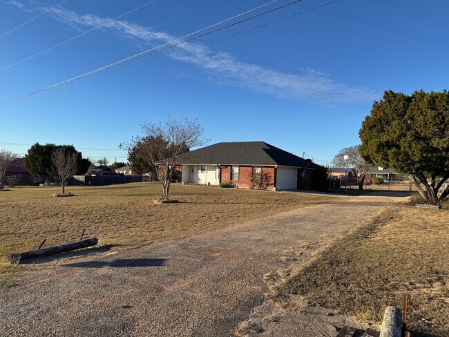 Building Photo - Charming 3-bedroom, 2-bath home offering peaceful country living on just under an acre.