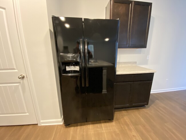 Side by Side refrigerator/freezer with in door water and ice dispenser - 9010 Fenton Rd.