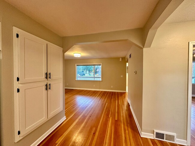 Building Photo - Stunning 2 level home with wood floors and...