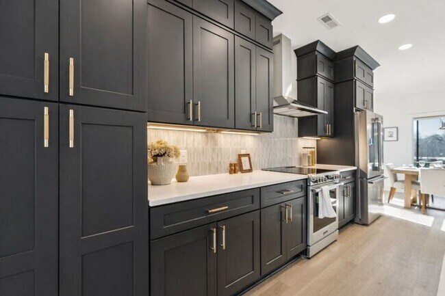 Building Photo - High-End 2BR Townhome | Rooftop Terrace + 2-Car Garage | 24-Unit Community