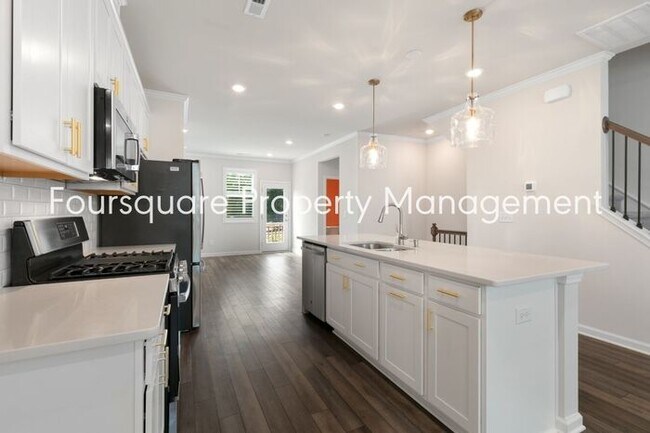 Building Photo - Stylish 3-Level Townhome with Bonus Suite, Deck & Garage – Near I-540 and Shopping