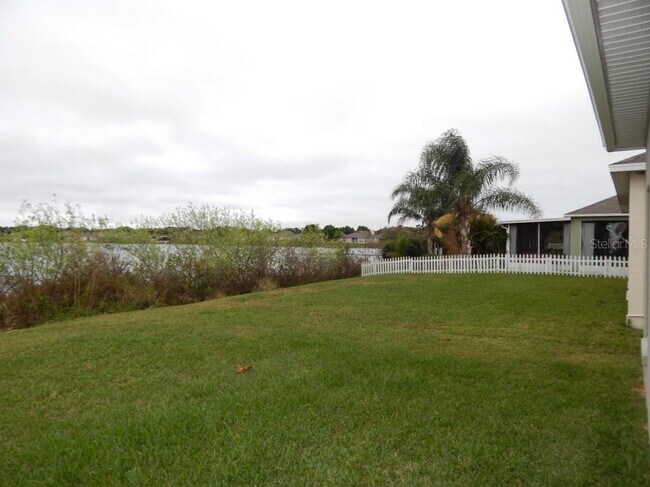 Building Photo - **Charming 4BR/2BA Pond-View Home with Boat Ramp Access – East Orlando **