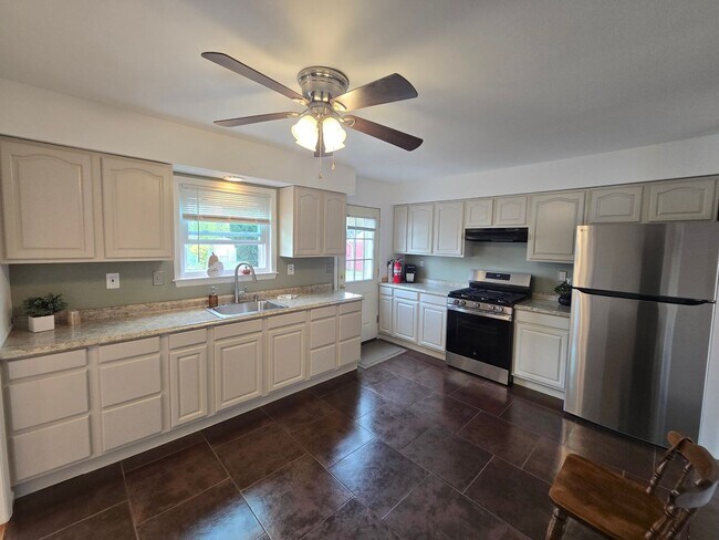 Building Photo - Updates abound at this SPACIOUS, half duplex with 3+ off-street parking spots, 3-bedrooms and 2 f...