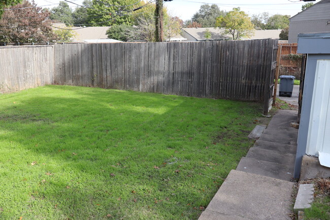 View from the back porch to the yard and alley. - 13559 Red Fern Ln