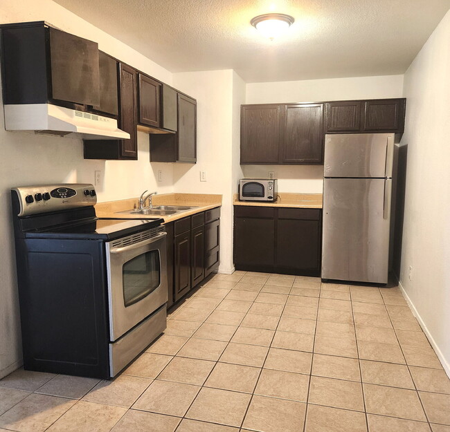 Building Photo - FIRST FLOOR LIVING WITH OPEN KITCHEN, DEN & CARPORT – GCU ACCESS